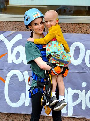 Natalie Joiner, who rappelled off the Trustmark building in downtown Jackson in a Friends of Children’s Hospital “Over The Edge” fundraiser, holds her inspiration, Iva Beth Lindsey, in 2018.